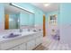 Bathroom featuring a shower and double sink at 518 W School St, Maiden, NC 28650