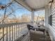 Relaxing balcony with seating and string lights offers a charming outdoor space at 5617 Fairview Rd # 9, Charlotte, NC 28209