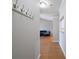 Hallway showing a view of the living room with hardwood flooring at 5617 Fairview Rd # 9, Charlotte, NC 28209