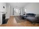 Comfortable living room with modern decor, fireplace, natural light and access to a balcony at 5617 Fairview Rd # 9, Charlotte, NC 28209