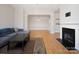Inviting open living space featuring fireplace, dining area, and views of the kitchen, great for gatherings at 5617 Fairview Rd # 9, Charlotte, NC 28209