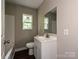 Cozy bathroom features a modern vanity, toilet, and a window at 6225 Macon St, Charlotte, NC 28208