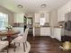 Bright kitchen with white cabinetry, stainless steel appliances, and a breakfast nook bathed in natural light at 6225 Macon St, Charlotte, NC 28208