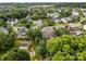 Aerial view of a lovely home in a lush, green neighborhood with mature trees and manicured lawns at 6533 Derby Nw Ln, Concord, NC 28027