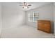 Bedroom with neutral carpet, wooden dresser and a bright window with green views at 6533 Derby Nw Ln, Concord, NC 28027