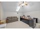 Second bonus room with desk, sofa, sky light and cozy ambiance at 6533 Derby Nw Ln, Concord, NC 28027