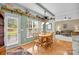Dining area with a wooden table, natural light, and open shelving at 6533 Derby Nw Ln, Concord, NC 28027