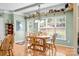 Dining area with wood table and chairs, open shelving, and view to outdoors at 6533 Derby Nw Ln, Concord, NC 28027