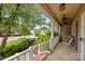 Inviting front porch with white railings, ceiling fans, and a relaxing seating area at 6533 Derby Nw Ln, Concord, NC 28027