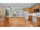 Bright kitchen with a center island, wooden cabinetry, and stainless steel appliances at 6533 Derby Nw Ln, Concord, NC 28027