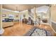Spacious living area featuring hardwood floors, staircase, and open access to other rooms at 6533 Derby Nw Ln, Concord, NC 28027