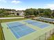 A high angle showcases well-maintained tennis courts alongside a refreshing community pool and lush landscaping at 6533 Derby Nw Ln, Concord, NC 28027