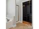 Primary bathroom with a walk-in shower, soaking tub, and custom closet at 6618 Alexander Rd, Charlotte, NC 28270