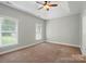 Large bedroom with a trey ceiling and large windows that provide natural light at 6618 Alexander Rd, Charlotte, NC 28270