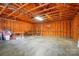 Garage with exposed wooden beams and concrete flooring at 6618 Alexander Rd, Charlotte, NC 28270