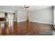 Spacious living room with hardwood floors and a seamless flow to the adjacent kitchen at 6618 Alexander Rd, Charlotte, NC 28270