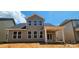 Backyard with a covered patio and expansive windows at 725 Sirius Ln # 90, York, SC 29745