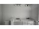 Modern bathroom features a double vanity with white cabinets and countertop at 725 Sirius Ln # 90, York, SC 29745