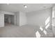 Bright bedroom with carpet, natural light, and an open door, showcasing a serene and airy space at 725 Sirius Ln # 90, York, SC 29745