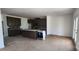 Open-concept kitchen with a center island, dark wood cabinets, and modern appliances at 725 Sirius Ln # 90, York, SC 29745
