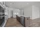 View of the open kitchen with island, stainless steel appliances and white cabinets at 725 Sirius Ln # 90, York, SC 29745