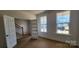 Inviting living room with ample natural light from windows and doorway access to the staircase at 725 Sirius Ln # 90, York, SC 29745