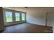 Bright living room filled with natural light from three large windows at 725 Sirius Ln # 90, York, SC 29745