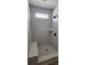 New shower with white marbled tiles, a shower bench, and a window at 725 Sirius Ln # 90, York, SC 29745