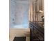 Elegant bathroom features a tub, tiled walls, and marble tile surround at 746 Sinclair Dr, Monroe, NC 28112