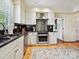 Well-equipped kitchen boasts stainless steel appliances, granite countertops, and white cabinetry at 828 Colville Rd, Charlotte, NC 28207