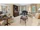 Cozy living room featuring a decorative hutch, piano, and neutral patterned carpet at 828 Colville Rd, Charlotte, NC 28207