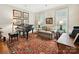 Elegant living room featuring a grand piano, plush seating, and stylish decor at 828 Colville Rd, Charlotte, NC 28207