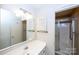 Bathroom with sink, vanity, mirror and shower with glass doors at 8356 Meadow Lakes Dr, Charlotte, NC 28210