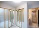 Bedroom featuring mirrored closet doors and a view to the attached bathroom at 8356 Meadow Lakes Dr, Charlotte, NC 28210