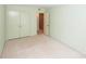 A bedroom featuring a closet and access to another room, all bathed in a soft, neutral color scheme at 8356 Meadow Lakes Dr, Charlotte, NC 28210
