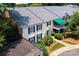 Aerial exterior view of a multi-story home featuring a balcony, manicured lawn, and lush landscaping at 8356 Meadow Lakes Dr, Charlotte, NC 28210