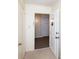 Hallway displaying unit doors, carpet, and access to other units, and white trim at 8356 Meadow Lakes Dr, Charlotte, NC 28210