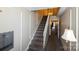 Hallway view with staircase, mailboxes, white railings, and neutral carpet, showcasing a clean, classic design at 8356 Meadow Lakes Dr, Charlotte, NC 28210
