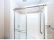 Bathroom shower featuring sliding glass doors and a grab bar at 8356 Meadow Lakes Dr, Charlotte, NC 28210