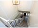 Bright stairwell with a white railing leads to a foyer with a view of the entrance at 8356 Meadow Lakes Dr, Charlotte, NC 28210