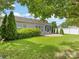 Green backyard with a stone patio, privacy fence, shade trees and screened in porch at 8603 Robinson Meadow Ct, Charlotte, NC 28277