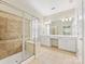 Bathroom featuring a glass shower and a dual sink vanity with a large mirror at 8603 Robinson Meadow Ct, Charlotte, NC 28277