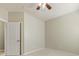 Carpeted bedroom featuring neutral walls, a ceiling fan, and a white door at 8603 Robinson Meadow Ct, Charlotte, NC 28277