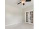 Light filled bedroom featuring a ceiling fan and glass paneled french doors at 8603 Robinson Meadow Ct, Charlotte, NC 28277