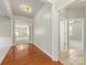 Inviting home foyer boasts hardwood floors and a view of multiple rooms at 8603 Robinson Meadow Ct, Charlotte, NC 28277