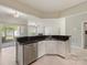 Modern kitchen featuring granite countertops and stainless steel appliances at 8603 Robinson Meadow Ct, Charlotte, NC 28277