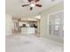 Open concept living room with views of the kitchen and natural light at 8603 Robinson Meadow Ct, Charlotte, NC 28277