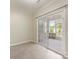 Sunroom with sliding glass door overlooking outdoor porch area at 8603 Robinson Meadow Ct, Charlotte, NC 28277