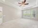 Bright main bedroom with neutral walls, carpet and a ceiling fan; three windows provide natural light at 8603 Robinson Meadow Ct, Charlotte, NC 28277