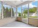 Relaxing screened porch with views of the backyard, offering a perfect blend of indoor and outdoor living at 8603 Robinson Meadow Ct, Charlotte, NC 28277